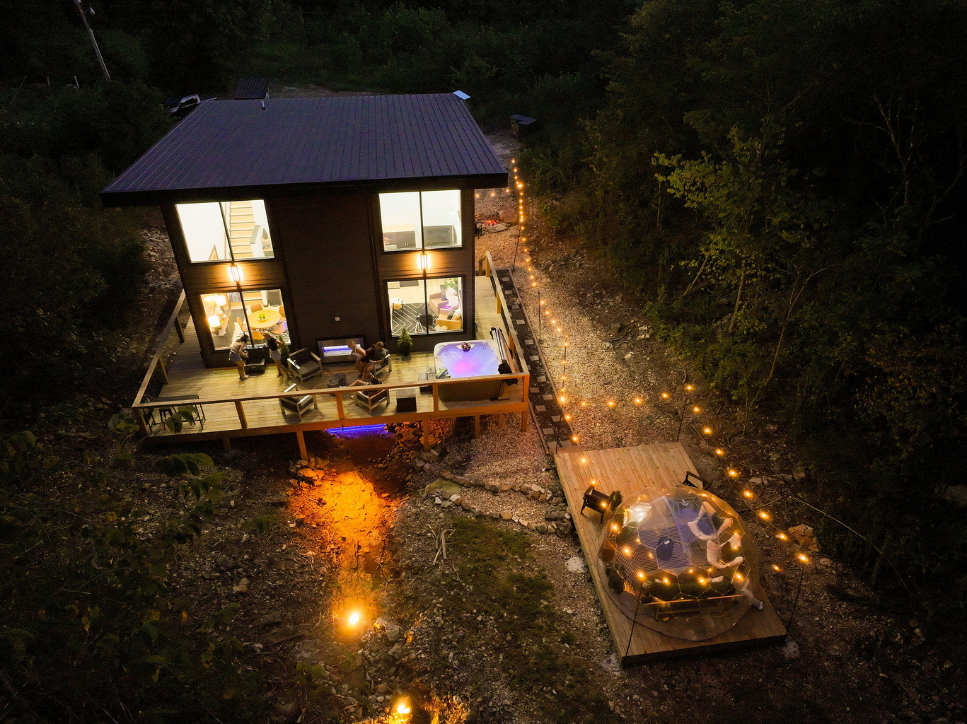 Stay above an Ozark creek surrounded by two wooded acres.