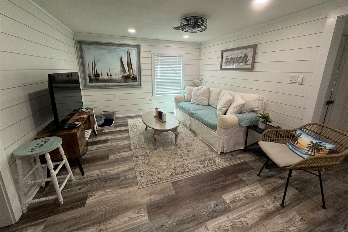 Living area with comfy couch and smart tv