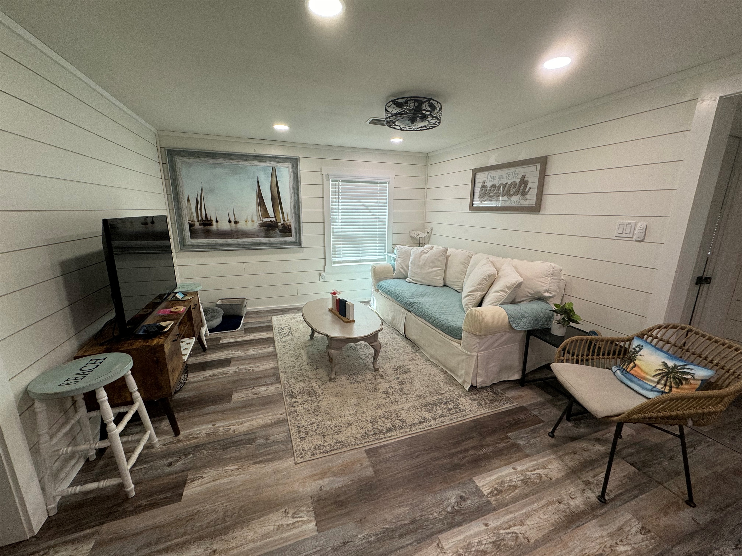 Living area with comfy couch and smart tv