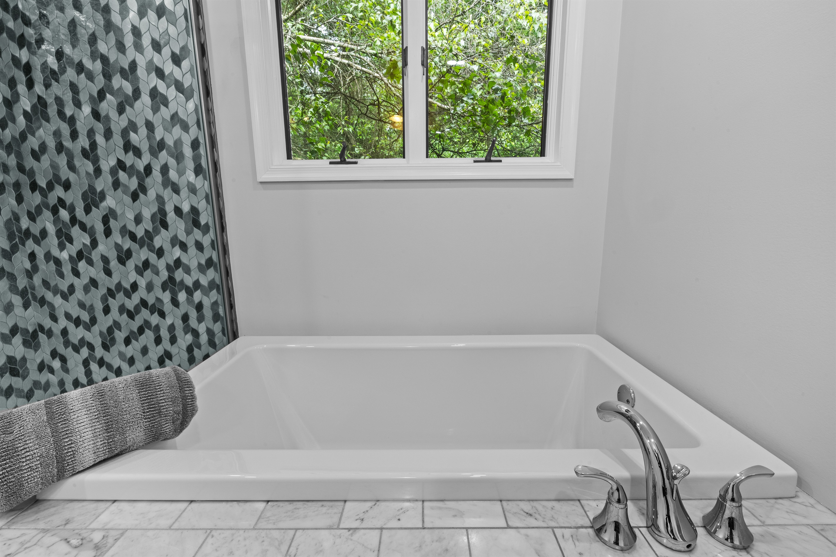 Spacious full bathroom featuring both a walk-in shower and soaking tub