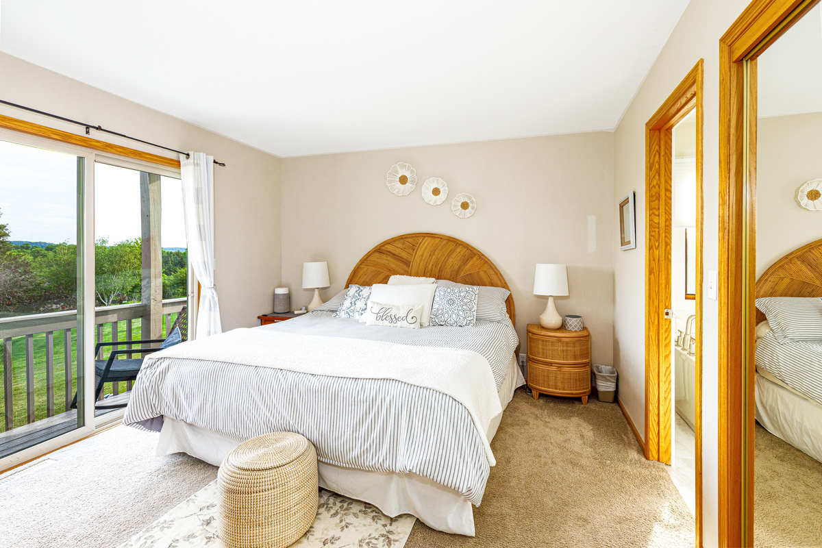 Main floor bedroom with ensuite bathroom and views of The Galena Territory