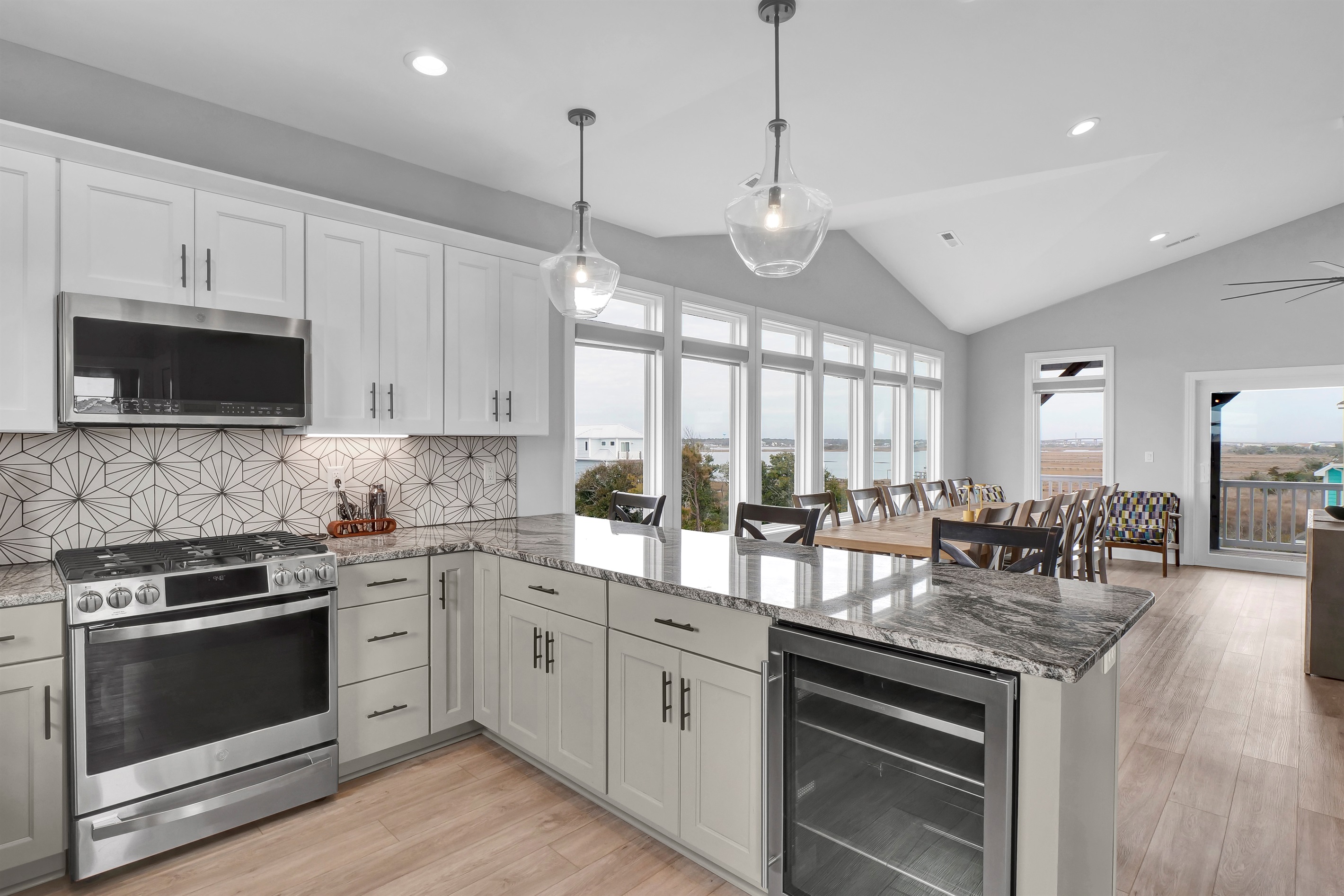 Cook, chat, and connect—this open kitchen to dining layout is ideal for gatherings and is designed for socializing and easy entertaining.