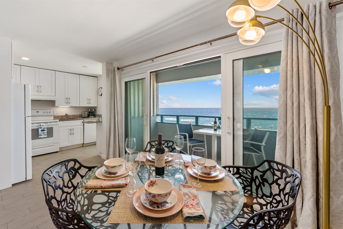 Dining for 4 guests located off of balcony and kitchen