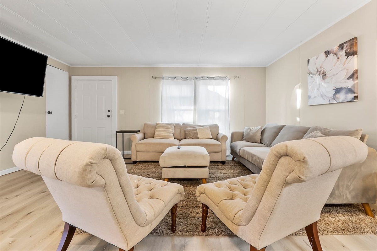 Inviting lounge with neutral tones and elegant décor, creating a warm and welcoming atmosphere.