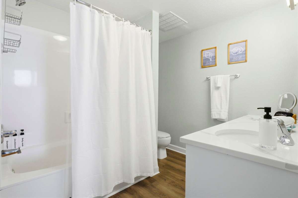With ample counter space and a full shower and tub combination, this bathroom is designed with comfort in mind.
