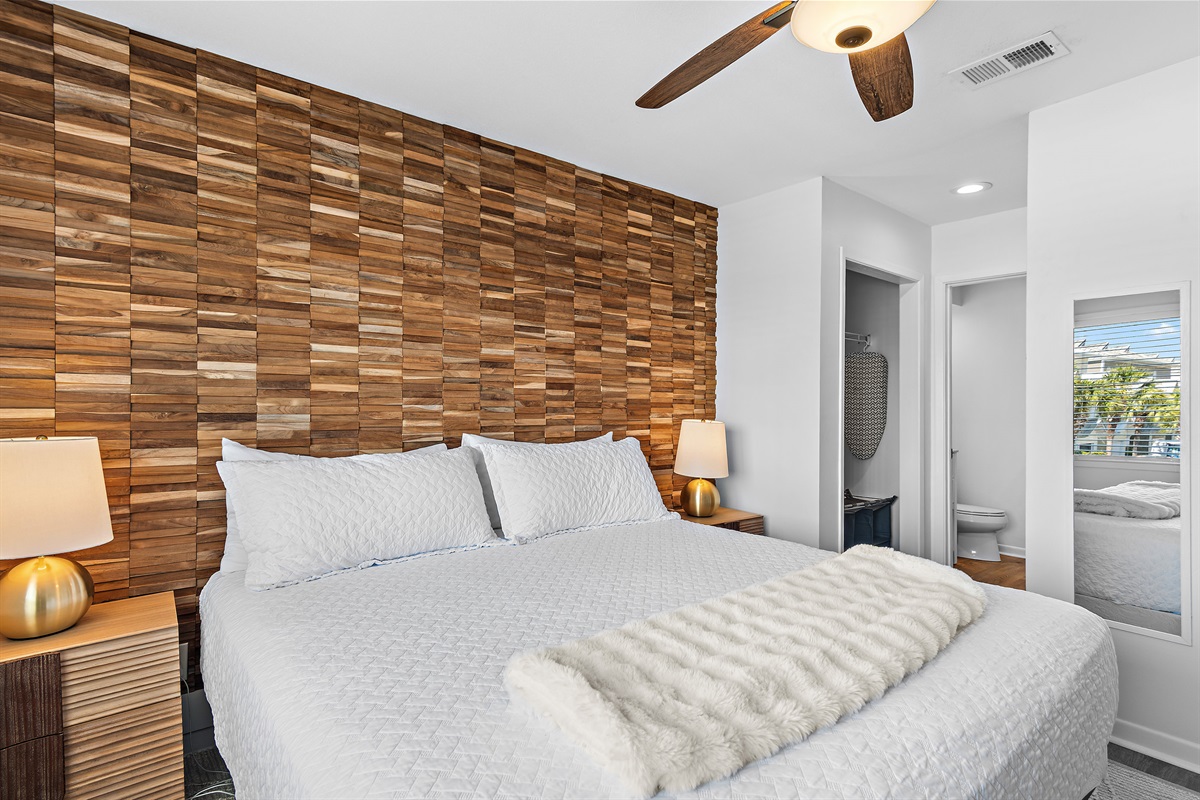 3rd Floor - Bedroom 2: King bed, ensuite bathroom with remodeled shower/tub combo, view of Scenic Gulf Drive, Smart TV (Sleeps 2)