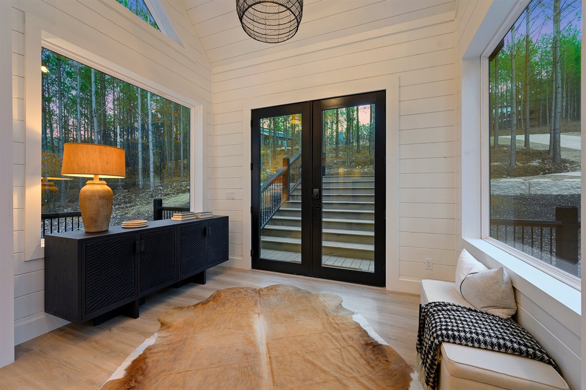 This inviting entry nook blends modern design with cozy cabin charm, creating the perfect welcome to your stay.