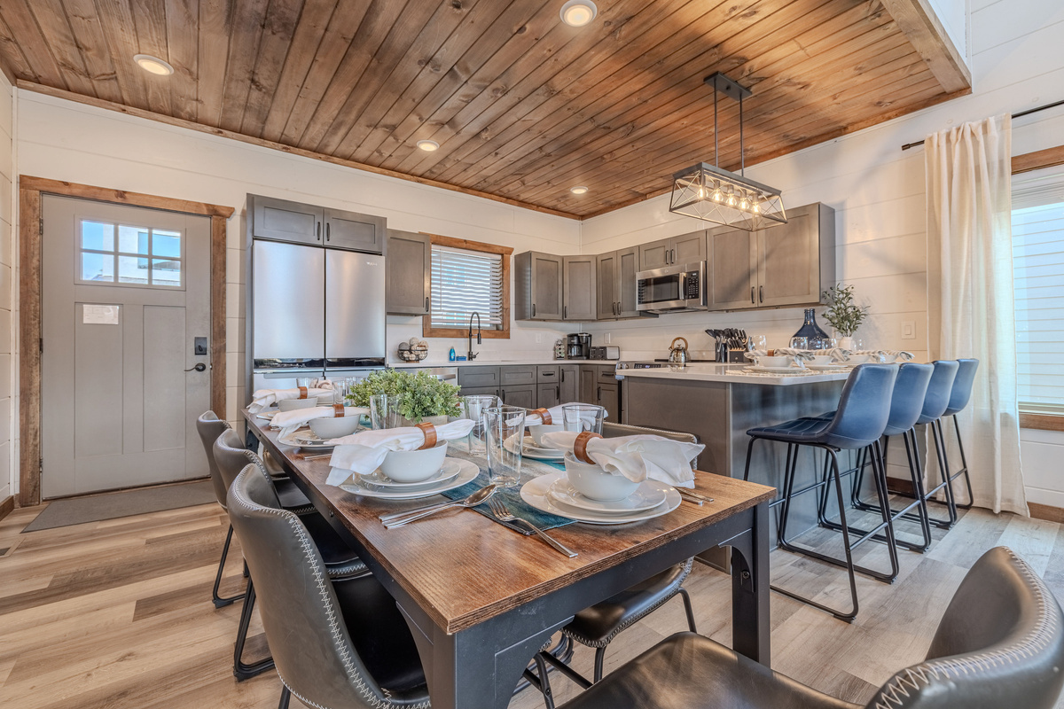 The dining table provides plenty of room for shared meals.