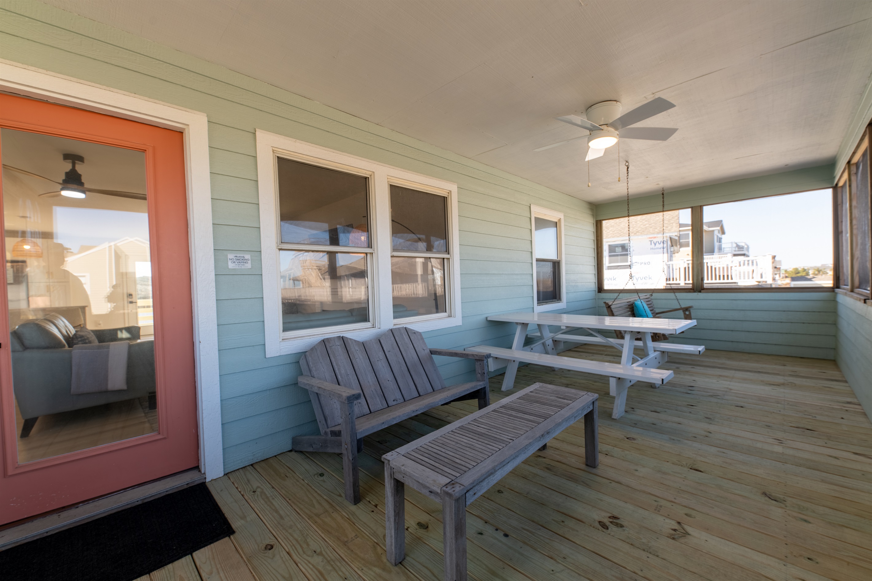 The large screened in porch is a great place to spend time outside with plenty of seating!