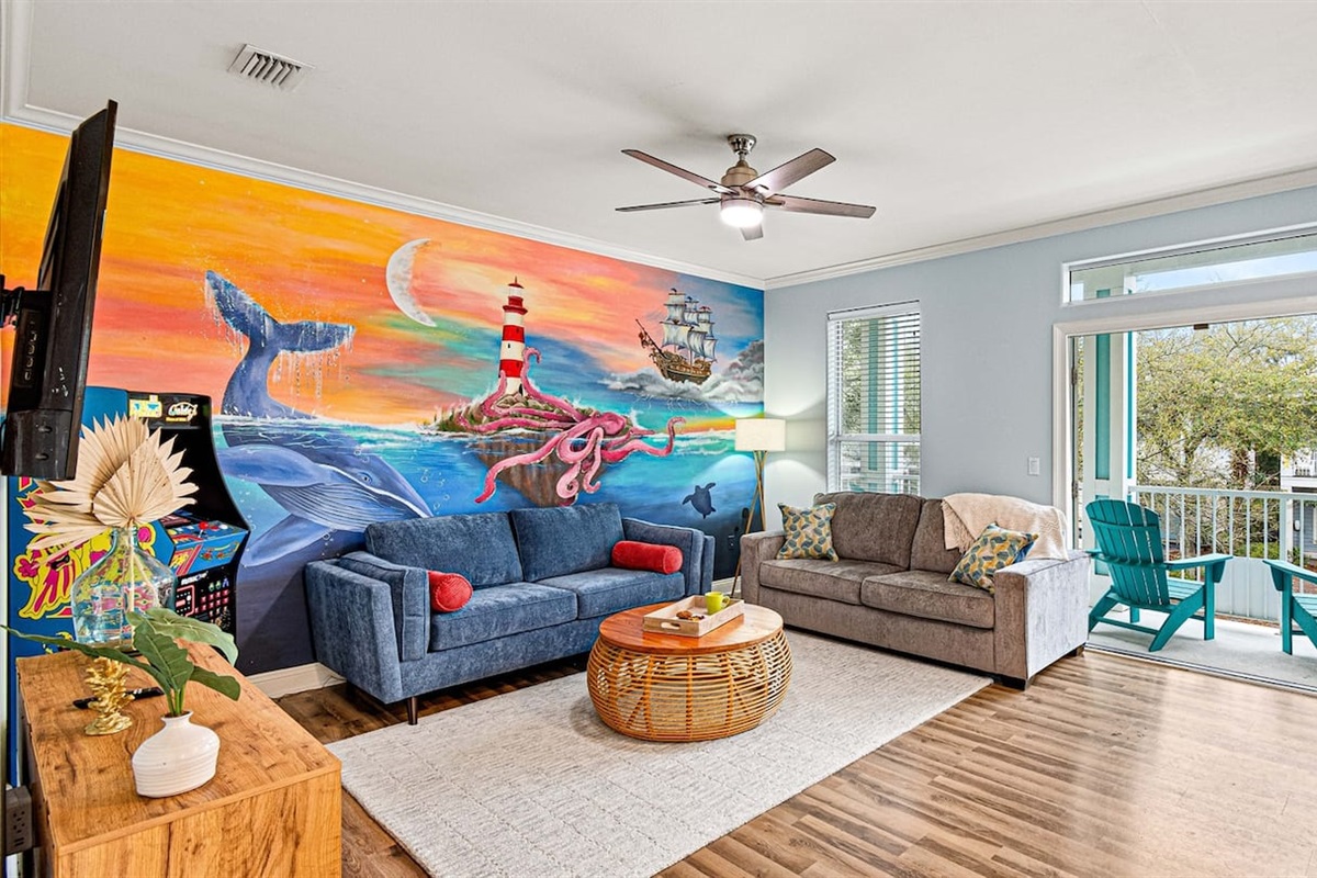The living room mural sets the tone — welcome to paradise