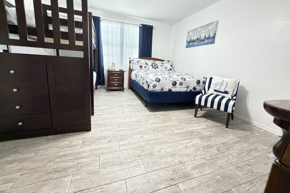 Room darkening curtains make it easy to unwind after a day at the beach or for afternoon naps.