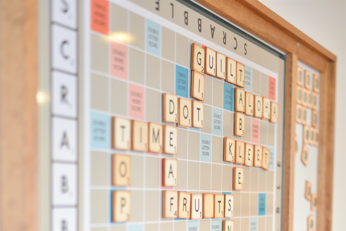 Massive wall Scrabble board + full library of books and board games for cozy nights in