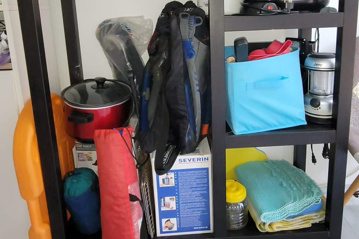 Common area room where there are some shared larger cooking appliances, assorted beach gear, emergency supplies, etc.