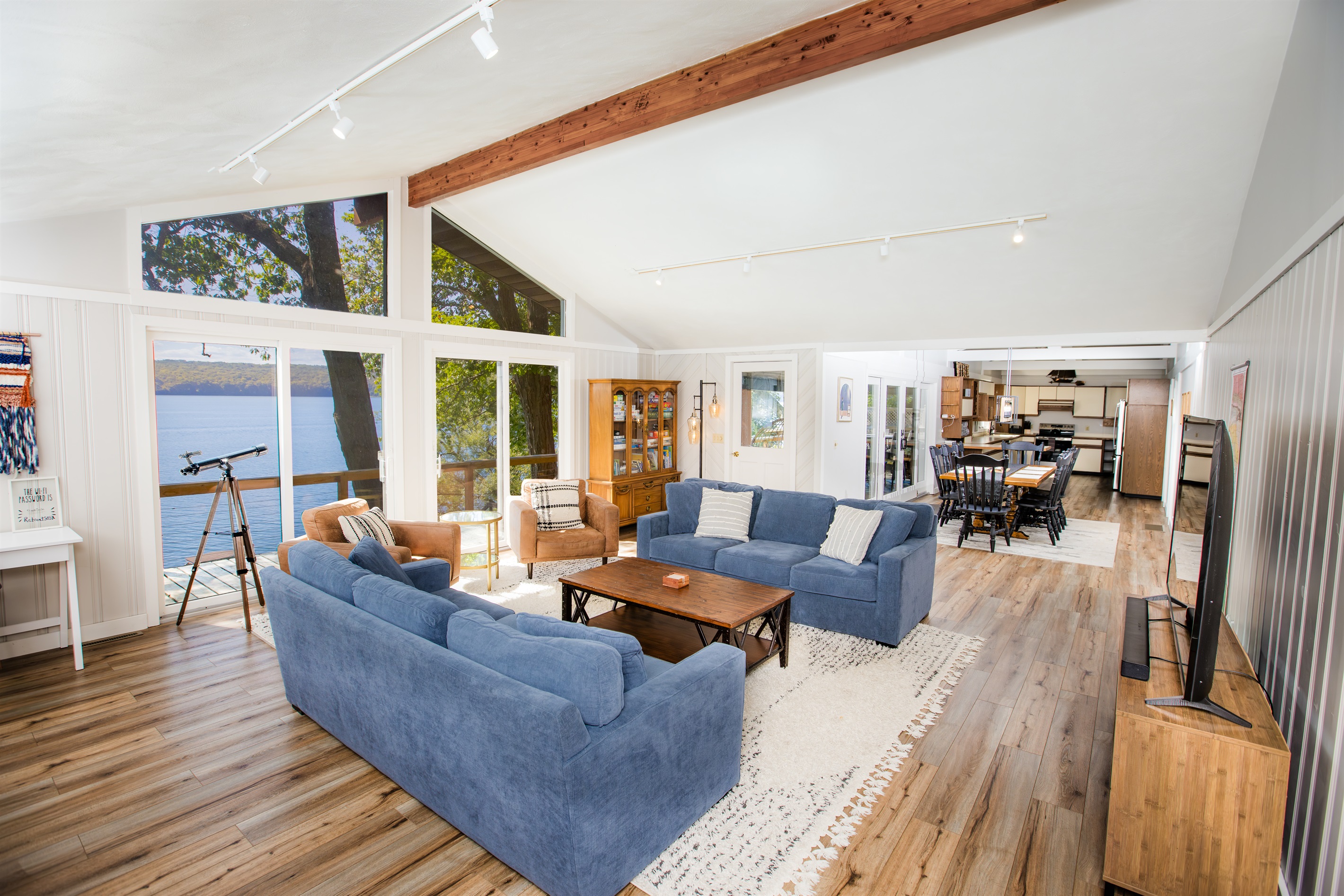 Living Room | China Cabinet Stocked with Books and Games for Adults and Children Living Room | 65" inch TV, Queen Size Pull Out Sofa Bed: Available on Request