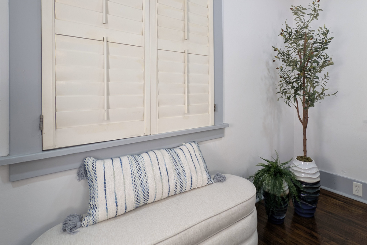 Take a moment to slow down. This cozy nook is the perfect place to enjoy your morning coffee, read a book, or simply relax.