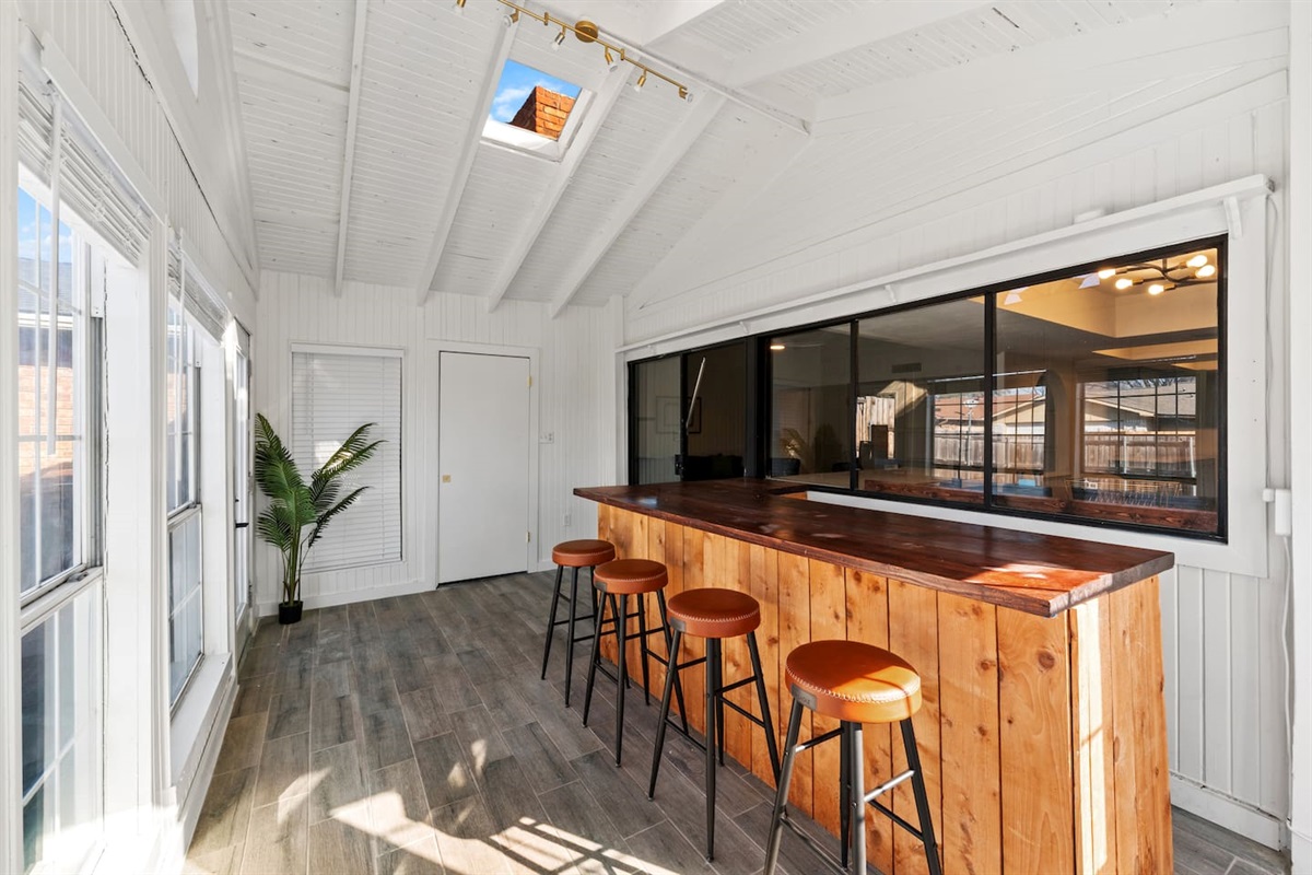 Host happy hour in the sunroom—your private indoor bar with seating for four and classic board games for laid-back fun.