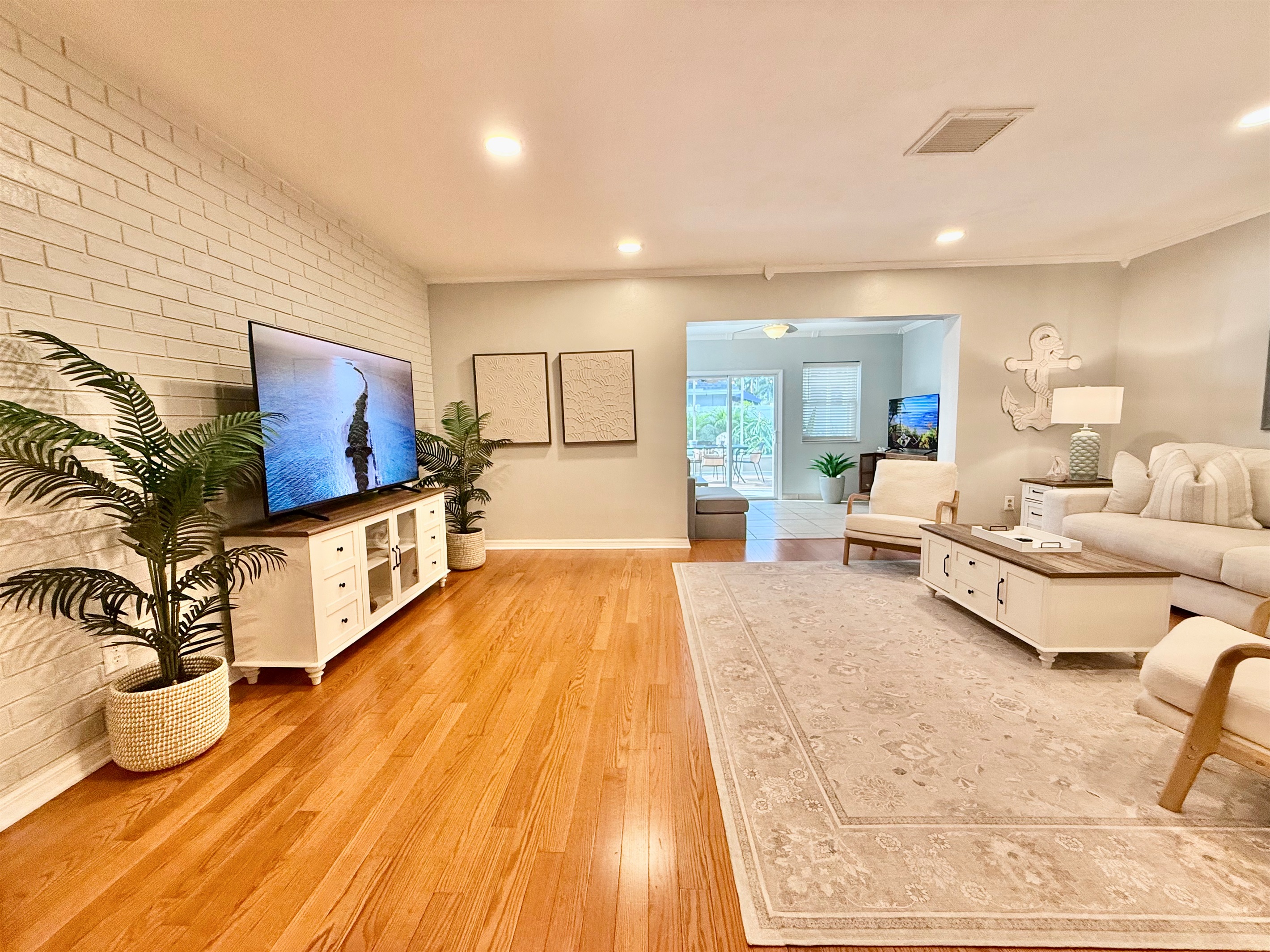 Designed with comfort in mind, this living room includes plenty of seating for the whole crew to gather, relax, and reconnect.