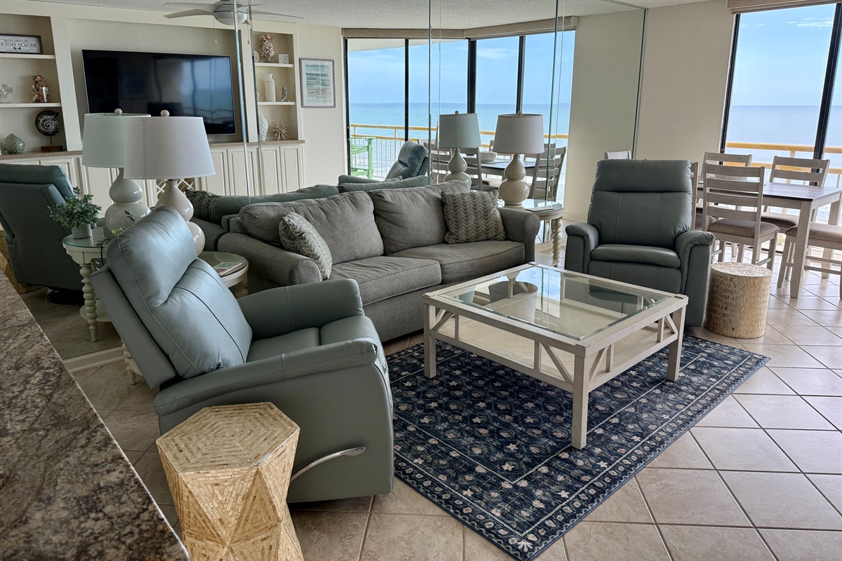 Sofa, 2 leather recliners, gorgeous view of the ocean, and super size TV