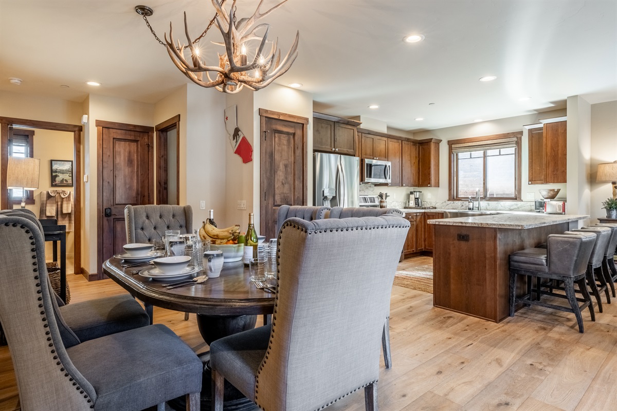 Dining and kitchen spaces connect seamlessly, creating an easy gathering place for families and groups staying at Bear’s Den.