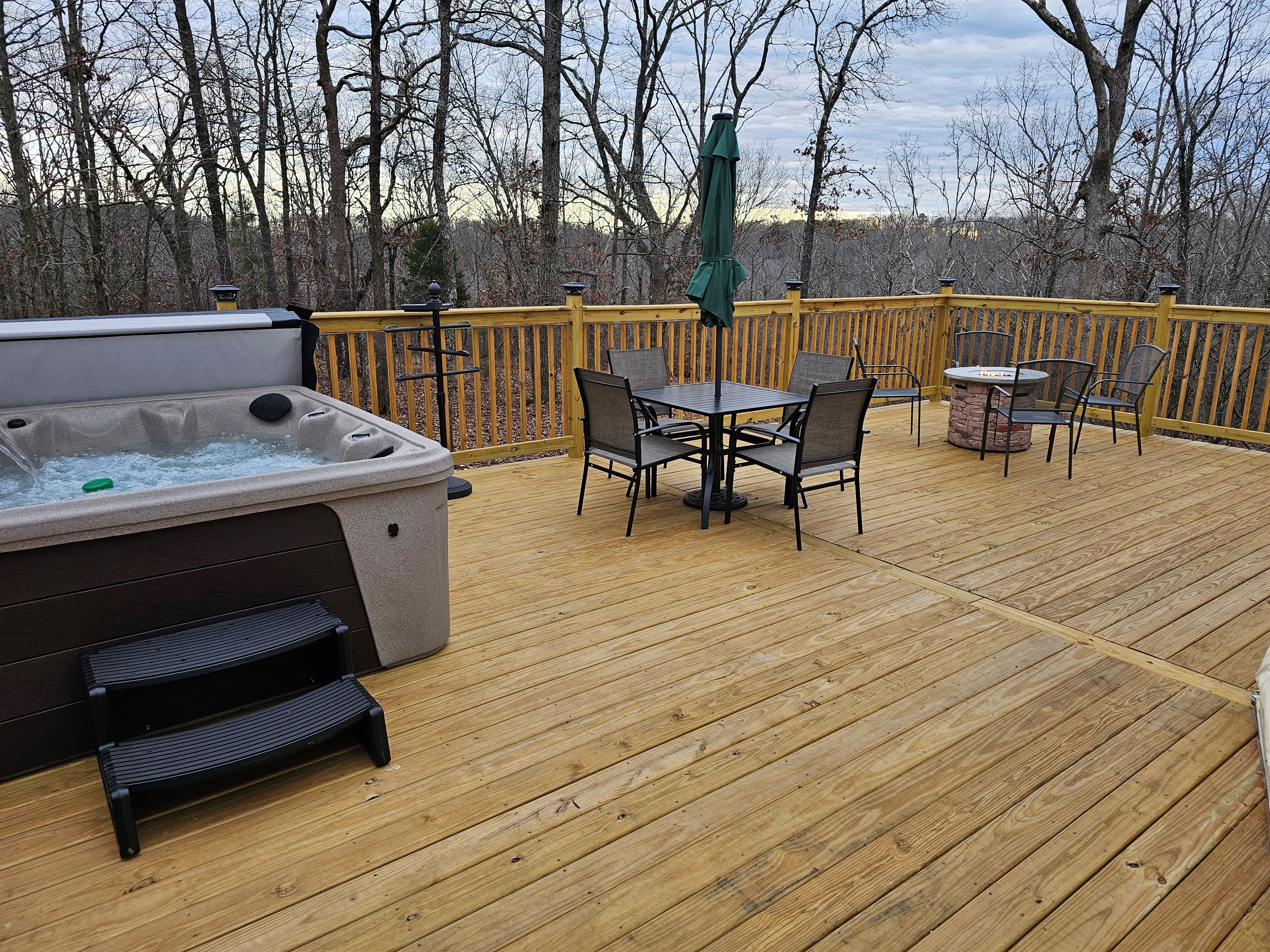 Soak, dine, and unwind on your private forest deck