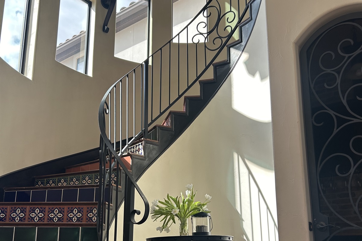 "Artisan Details in Every Step" Admire the stunning Talavera tiles on our staircase—each step brings a pop of color and character to the home.