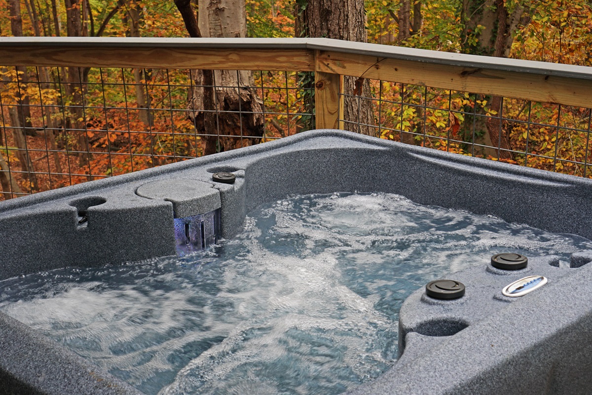 Tranquil moments guaranteed in this pristine hot tub setting. Relax and rejuvenate amidst the serene outdoor ambiance.