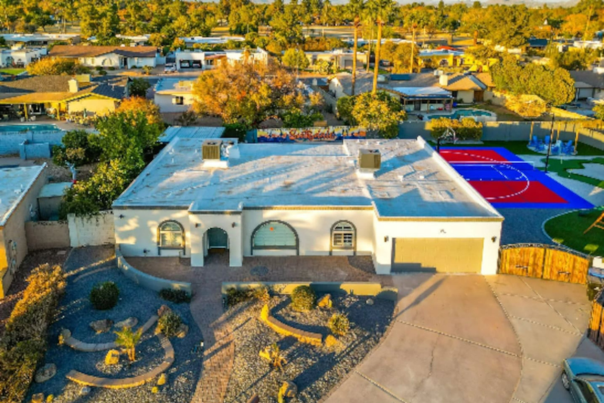 A classic Southwest facade with desert landscaping out front — a quiet first impression before the backyard steals the show.