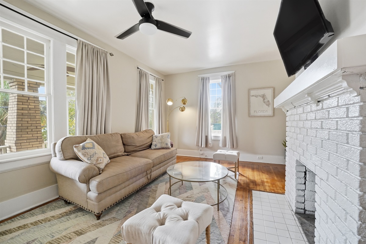 Living room with comfortable sofa, coffee table and TV
