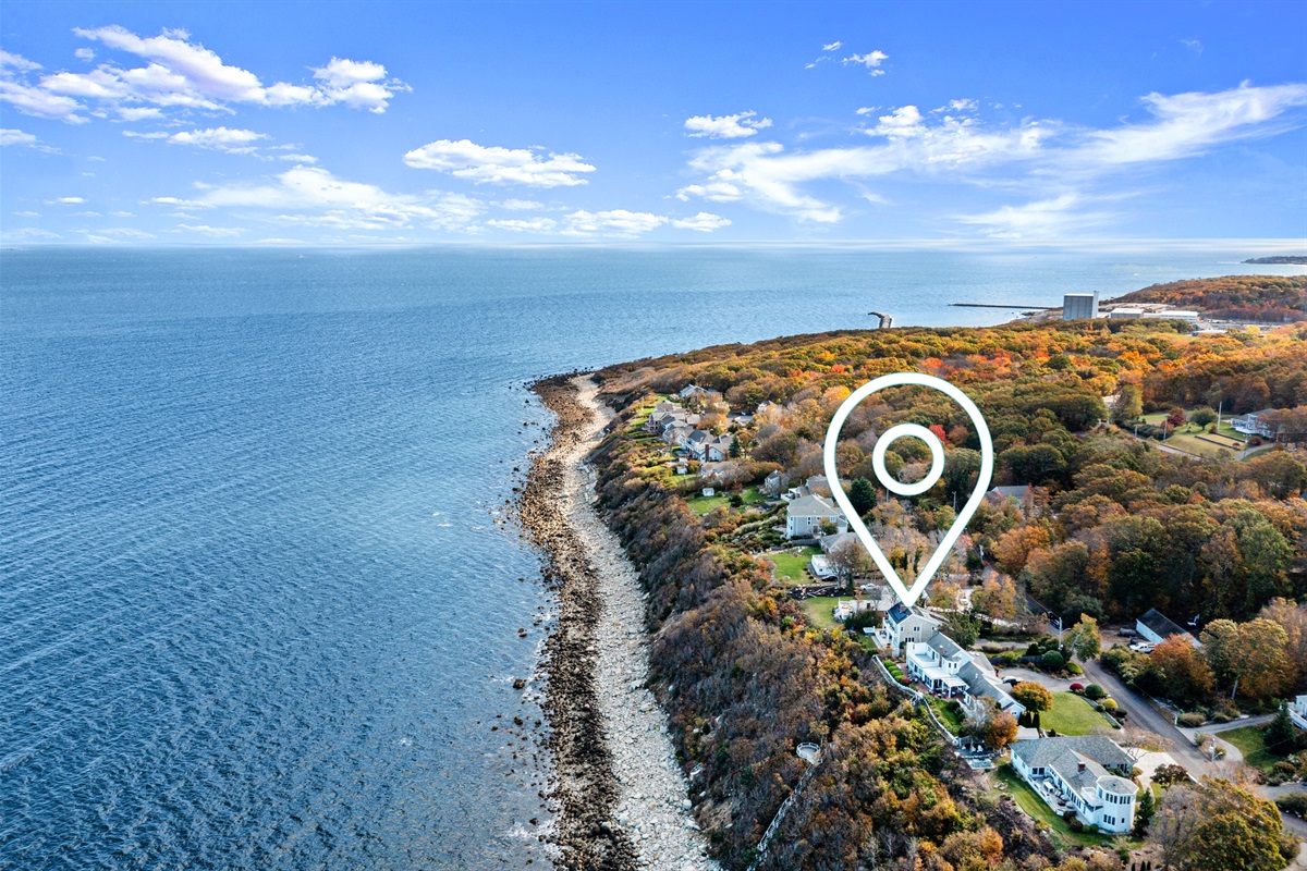 Aerial shot capturing the home and its breathtaking waterfront setting.
