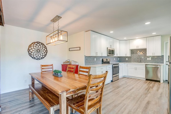 Dining area flowing into the kitchen — open layout perfect for shared meals and entertaining.