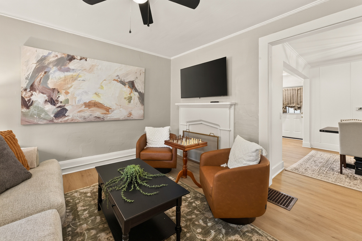 Living room with television and leather chairs