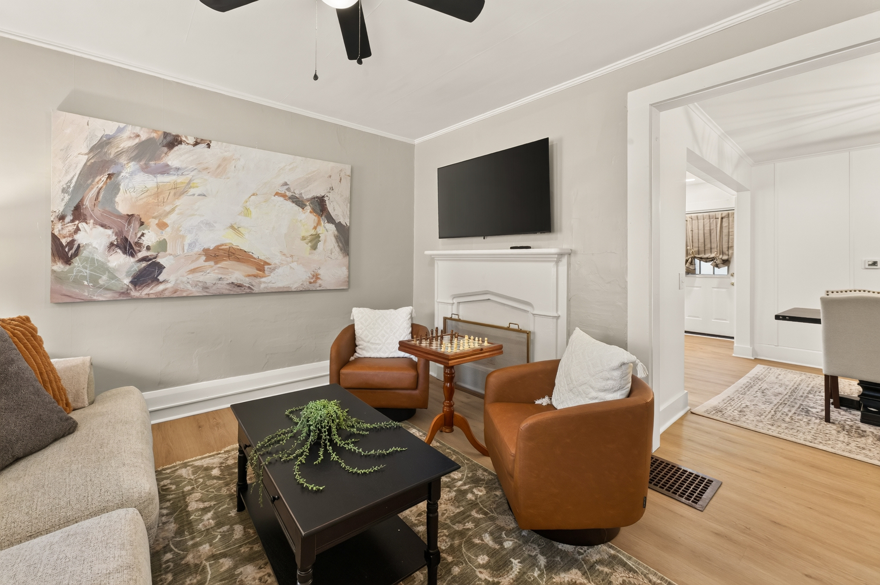 Living room with television and leather chairs