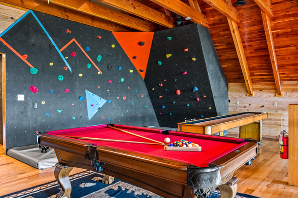 Billiard loft with a pool table and climbing wall, Majestica Lodge