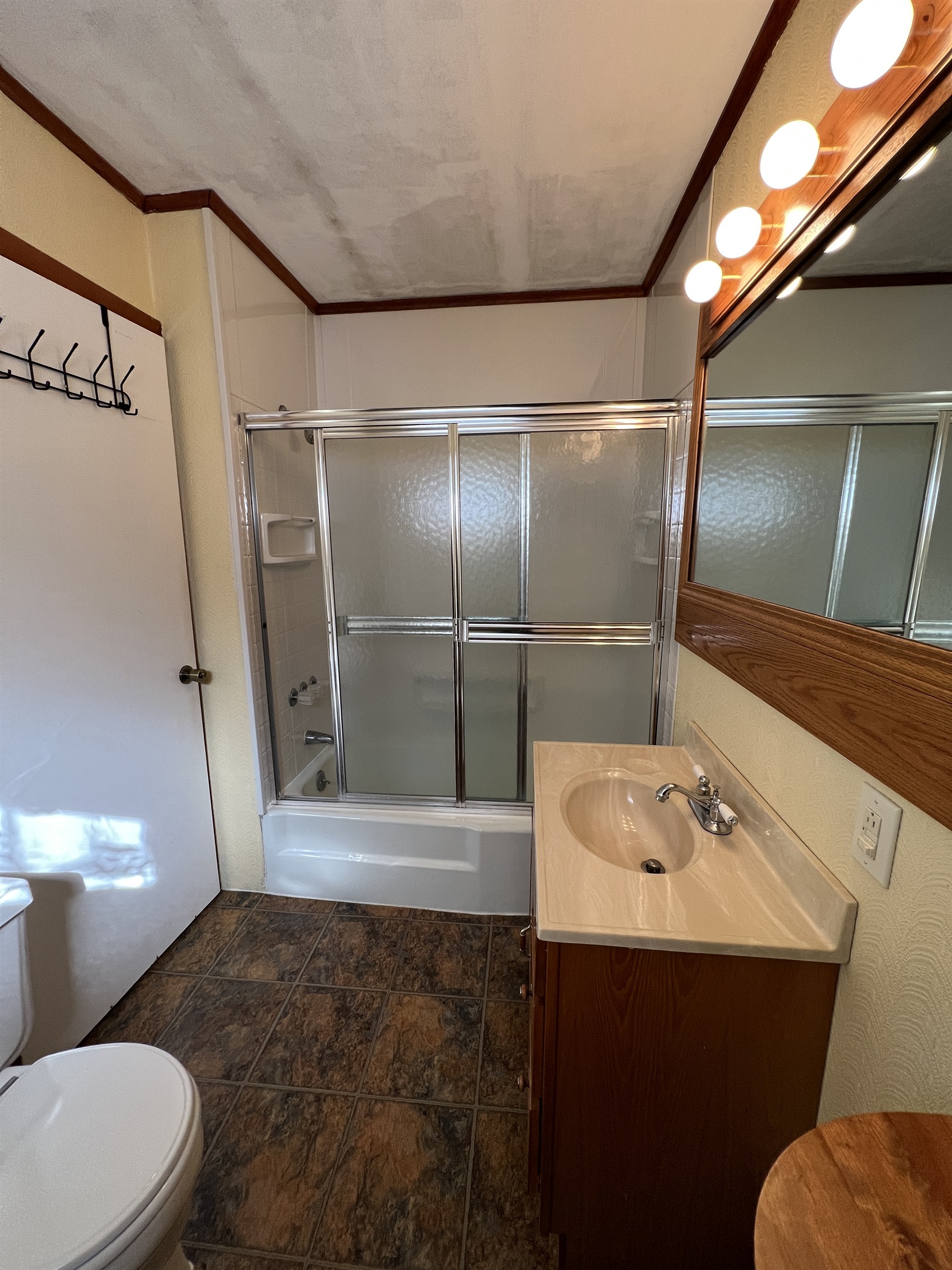 Bath with tub/shower off kitchen