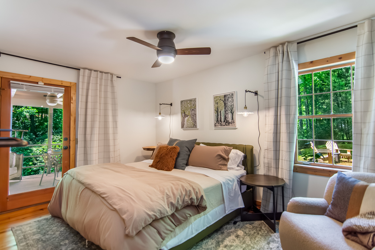 Primary bedroom with door leads to the screened porch 