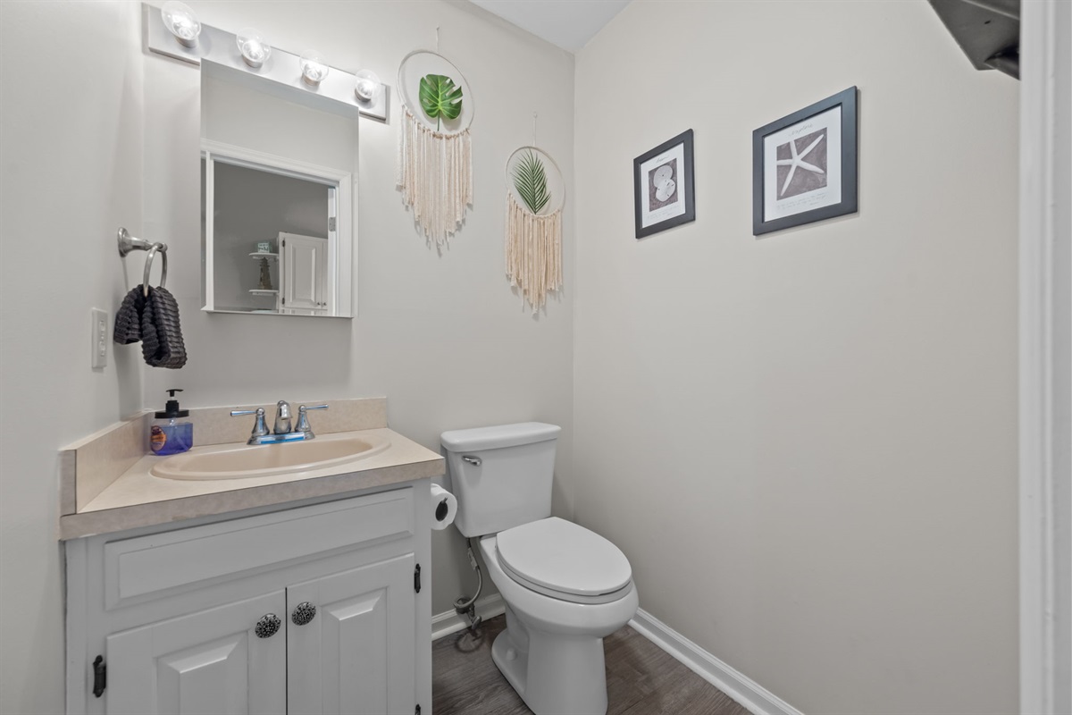 Convenient powder room, perfect for quick refreshes without heading upstairs