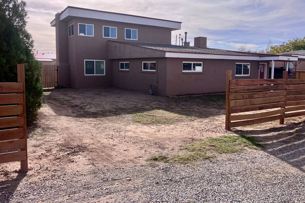 We are waiting on the landscapers for full curb appeal. But you can pull your RV, trailers, or vehicles into the back yard through this gate. 30amp hookup back there. 