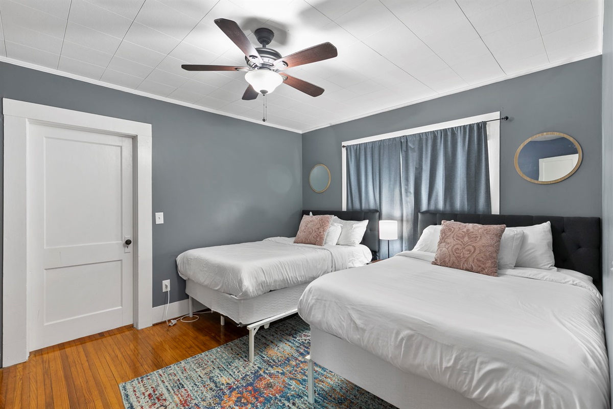 Settle into a spacious room with two full beds—perfect for sharing without feeling crowded