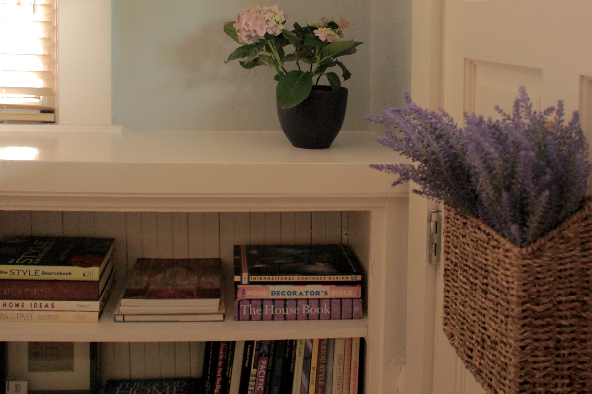 Built In Bookshelves with books and magazines and board games.