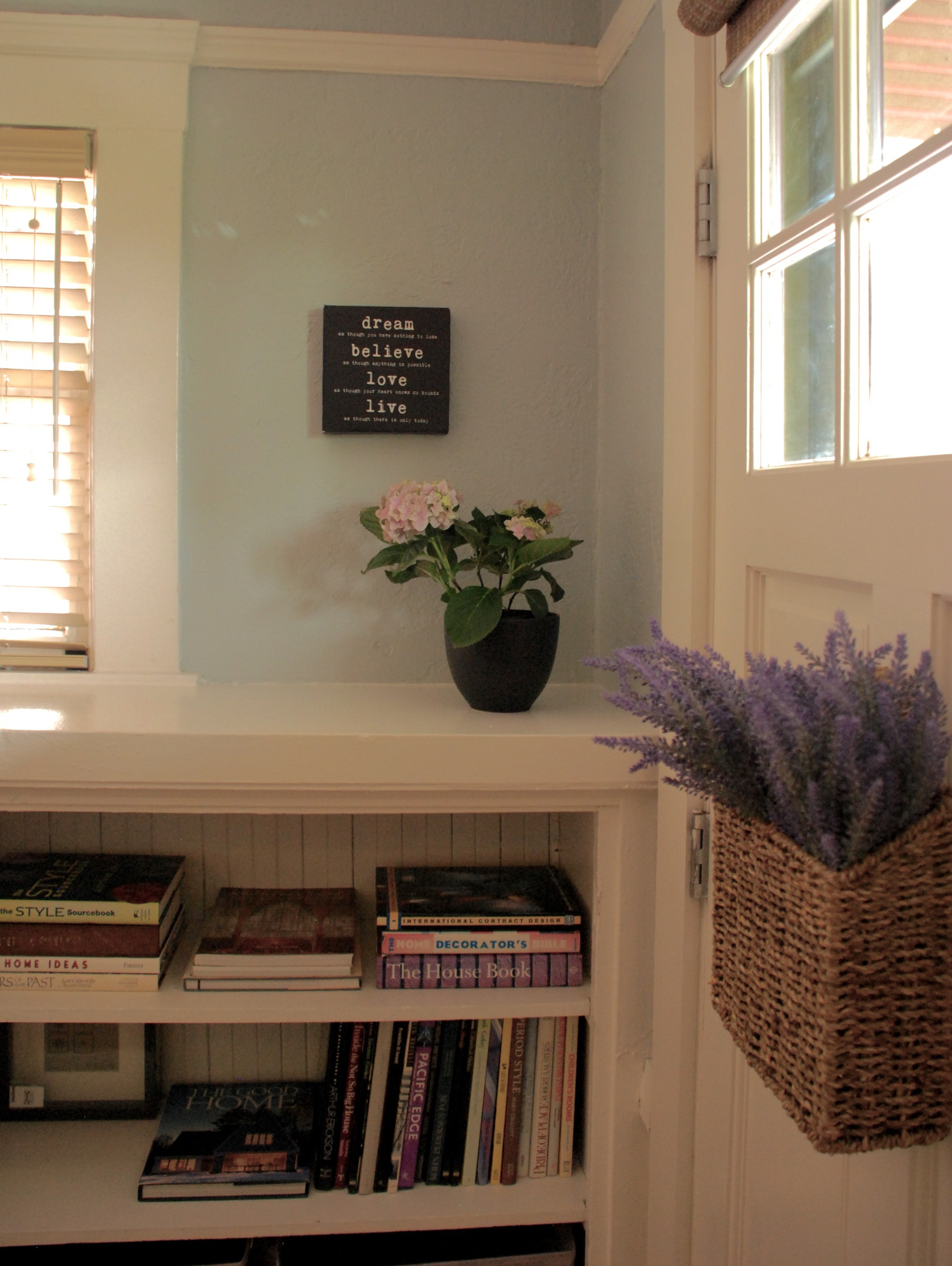 Built In Bookshelves with books and magazines and board games.