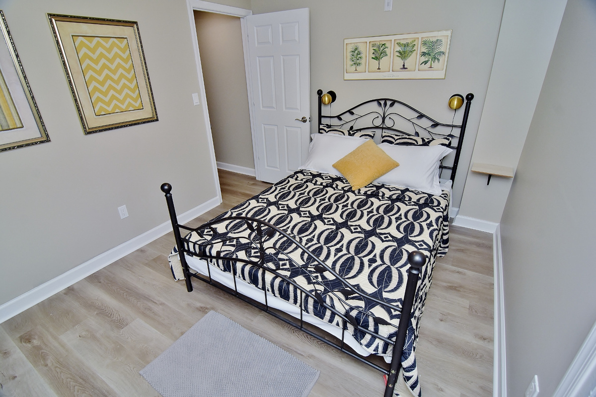Second bedroom with a queen-sized bed. 