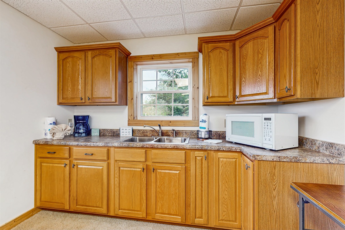 Lower bar area: Beverage fridge, wetbar, game table
