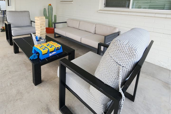 Additional covered outdoor lounge space with comfortable seating and tabletop games. Perfect extra space for relaxation, conversation and fun.