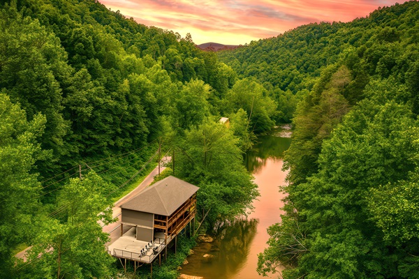 Welcome to Take Me to the River Cabin PERCHED ABOVE the famous Little Pigeon River. Enjoy a slice of paradise & nature on both decks facing the river just below you. Guest also have private river access along its edge just below the cabin.