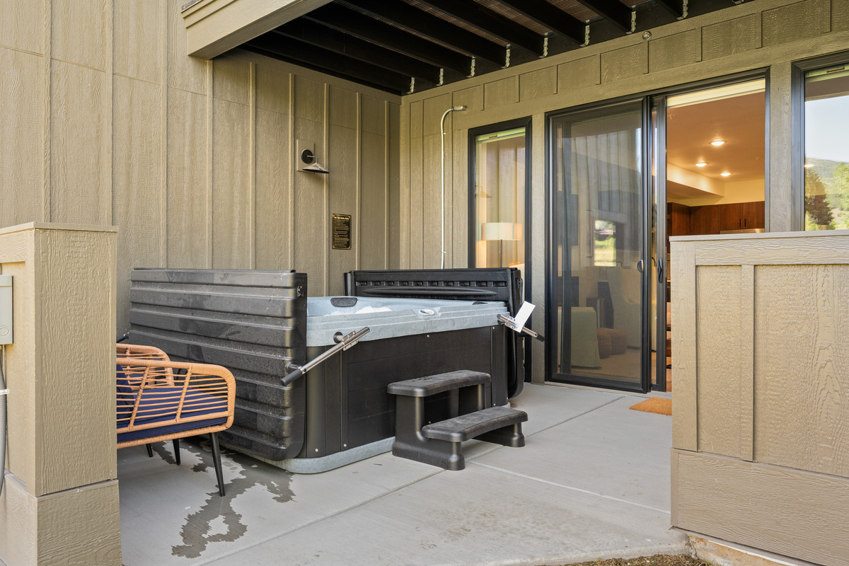Private covered hot tub patio—your perfect place to unwind after a day of skiing, hiking, or exploring.