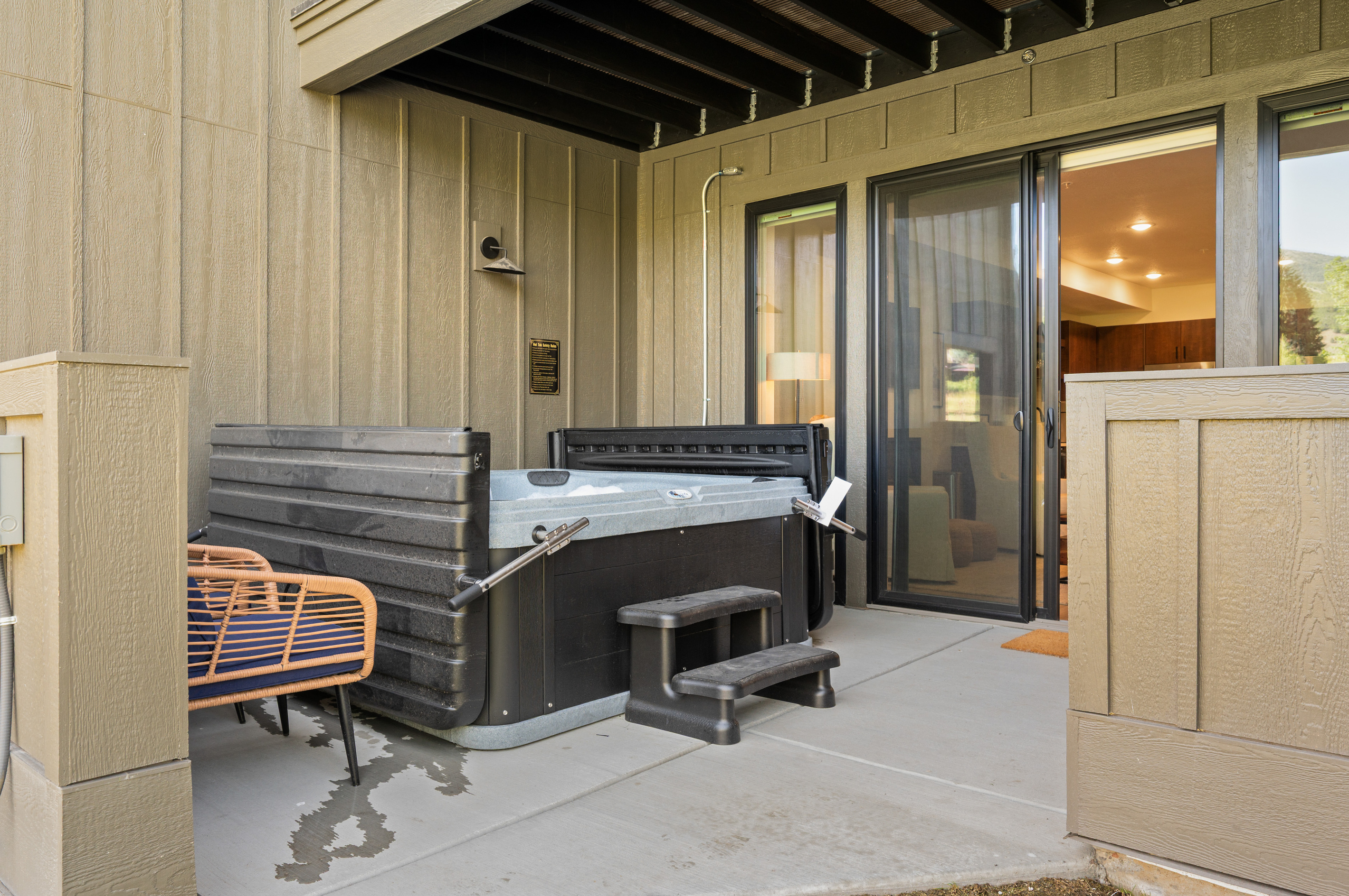 Private covered hot tub patio—your perfect place to unwind after a day of skiing, hiking, or exploring.