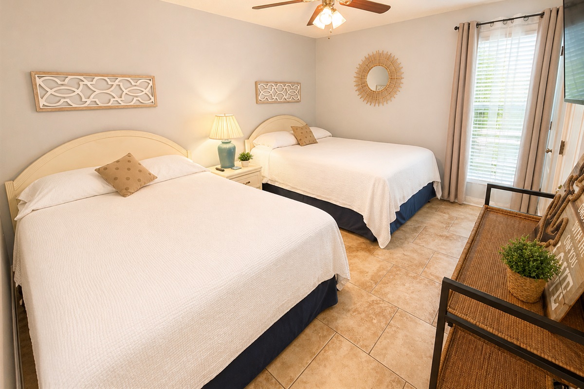 Main-level bedroom with 2 queen beds