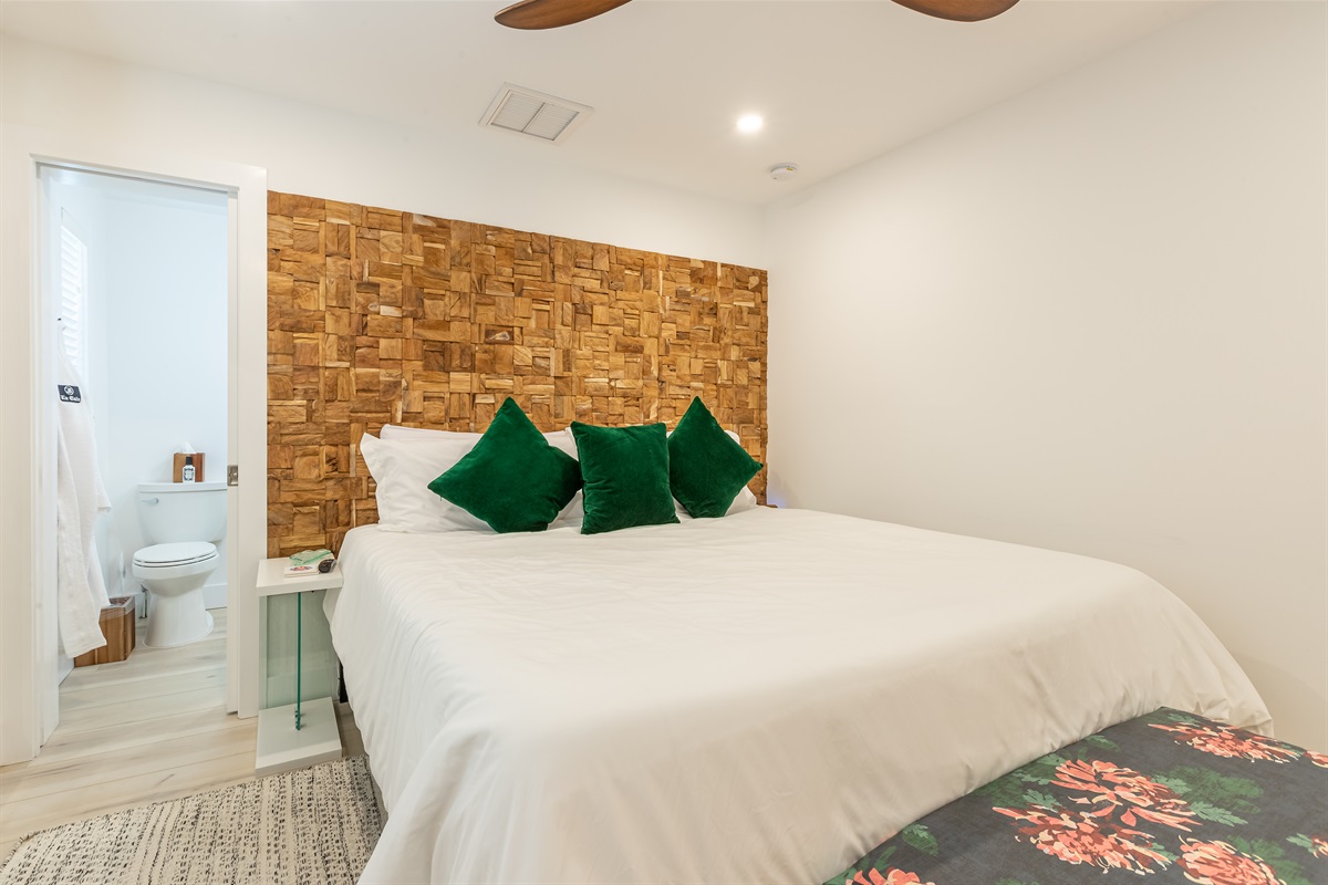 Master Bedroom: Relax in style with lush greenery and vibrant decor, just steps from paradise!
