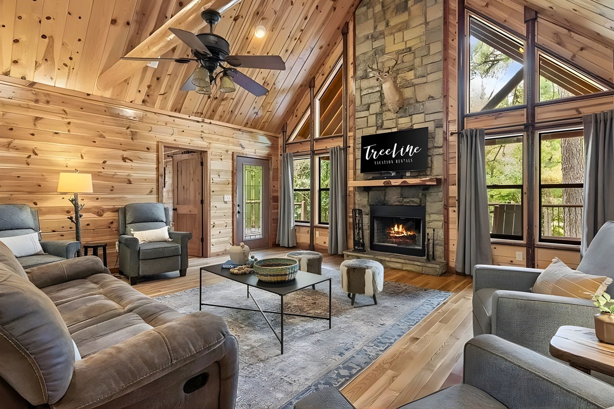 Settle in with comfortable seating arranged around the fireplace.