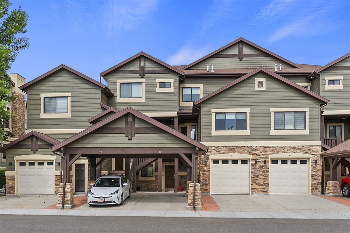 Exterior of the townhome with covered parking.